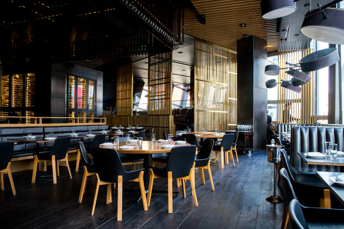 Warm restaurant interior at dinner service
